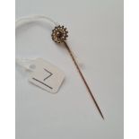 A gold and pearl stick pin