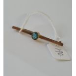 A blue stone bar brooch set in 9ct - 1.9gms