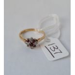 A diamond and ruby flowerhead ring (one stone missing) in 18ct gold - size M - 3.2gms