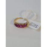 A five stone ruby ring in 18ct gold - size N1/2 - 3.7gms