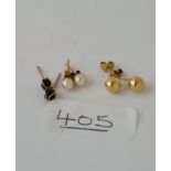 Three pairs of gold stud earrings