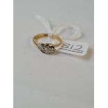 A 3 stone diamond ring in 18ct gold - size K - 2.3gms