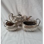 A REGENCY OVAL AND HALF-FLUTED TEASET WITH GADROON AND SHELL BORDERS - LONDON 1814 BY CH - 1250GMS