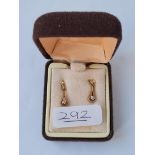 A pair of drop earrings set with diamonds in 9ct - boxed