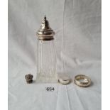 A cut-glass sugar caster with silver top - London 1926 - and a napkin ring etc.