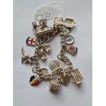 A silver charm bracelet - 59gms