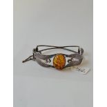 A silver vintage amber bangle