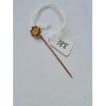 A diamond set stick pin in 15ct gold