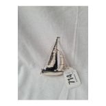 A silver sailing boat - 3" high - unmarked