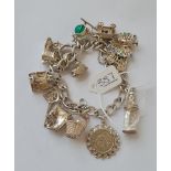 A silver charm bracelet - 53gms