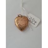 A heart-shaped back and front locket in 9ct
