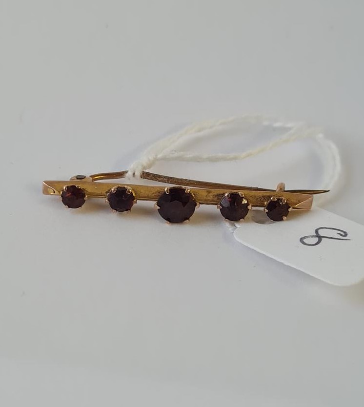 A five stone garnet brooch in 9ct