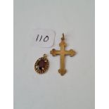 A bag containing a 9ct cross and pendant