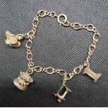A SILVER CHARM BRACELET WITH 4 CHARMS