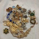 TUB OF COSTUME JEWELLERY WITH VARIOUS NECKLACES, BROOCHES ETC