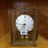 BRASS MANTLE CLOCK BY KUNDO, REVOLVING PENDULUM OF 4 BALLS - REQUIRES WORK 22cm HIGH INCL. LOOP