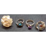 FOUR SILVER STONE SET RINGS