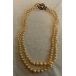 DOUBLE STRING OF SIMULATED PEARLS WITH WHITE METAL CLASP