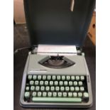 CASED HERMES BABY TYPEWRITER IN GOOD CONDITION IN GREEN CASE