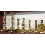 SHELF OF BRASS CANDLESTICKS ETC