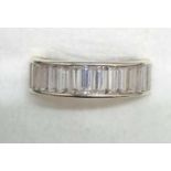 A 9ct WHITE GOLD MOUNTED ETERNITY RING - SIZE '0'