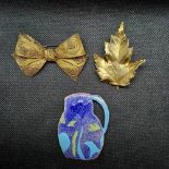 AN ENAMEL BROOCH, A FILIGREE BROOCH & ANOTHER