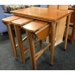 TEAK EFFECT NEST OF 4 TABLES WHICH FOLD OUT & HAVE DROP FLAPS