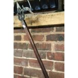 LONG WOODEN POLE WITH METAL HOOK END BELIEVED USED AS A POKER OR FOR RACKING COALS ETC