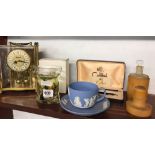 SHELF CONSISTING OF WEDGWOOD CUP & SAUCER, MAGNIFYING & LETTER OPENING SET, CARRAIGE CLOCK ETC
