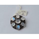 An arts & crafts silver & moon stone brooch