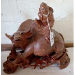 An Eastern carved water buffalo surmounted with figure on stand. 8 in high