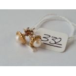 A pair of stud earrings in 9ct