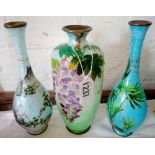 Three enamel decorated vases 7 in high ( One damaged)
