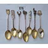 Seven Continental silver gift spoons.