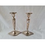 Pair of oval candlesticks with decorated rims and detachable nozzles. 9 in high London 1910. by H