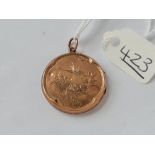 A circular back & front locket in 9ct - 4.1gms