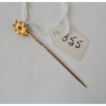 An Edwardian gold stick pin with single stone