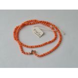 A coral bead necklace with 9ct clasp