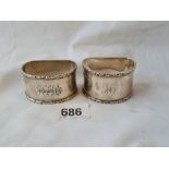 two napkin rings. D shaped with cast rims, one Sheffield 1914. 73gms