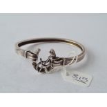 A silver horse shoe bracelet