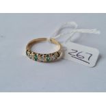 A 7 stone emerald & diamond ring in 9ct - size P