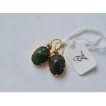 A pair gold mounted scarab drop earrings