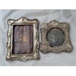 Two photo frames with embossed rims. 8in high.