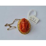 A VICTORIAN CORAL CAMEO WITH LOCKET BACK IN 15CT GOLD FRAME