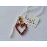 A heart shaped pendant with ruby's in 14ct gold - 1.9gms