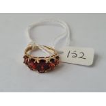 A five stone garnet dress ring in 9ct - size L - 2.8gms