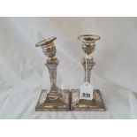 Pair of Edwardian Adam style candlesticks decorated with drapery. 7in high. London 1901 (One
