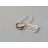 A solitaire diamond child's ring in 18ct gold - 1.5gms