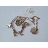 A silver charm bracelet, heart locket & chain, compass - 23.9gms