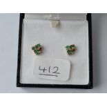 A pair of emerald & diamond earrings in 9ct